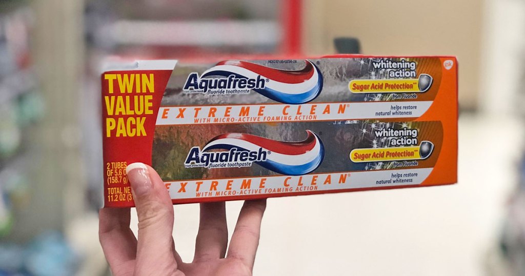 hand holding up aquafresh toothpaste 2-pack