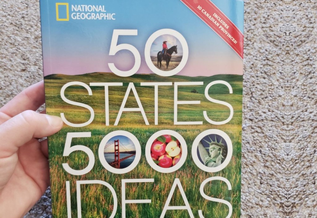 hand holding 50 states book