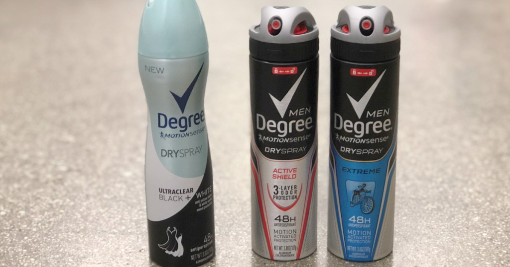 three bottles of dry spray deodorant