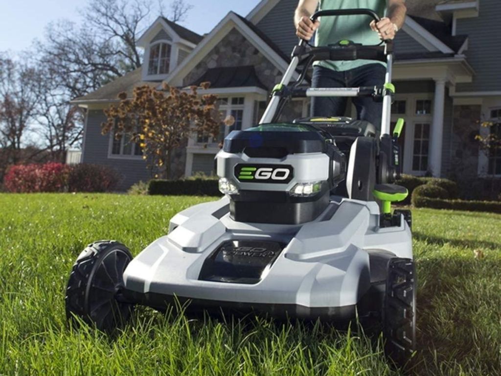 man pushing EGO lawn mower