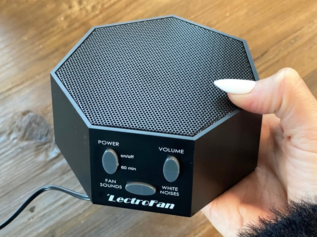 hand holding black LectroFan White Noise Sound Machine