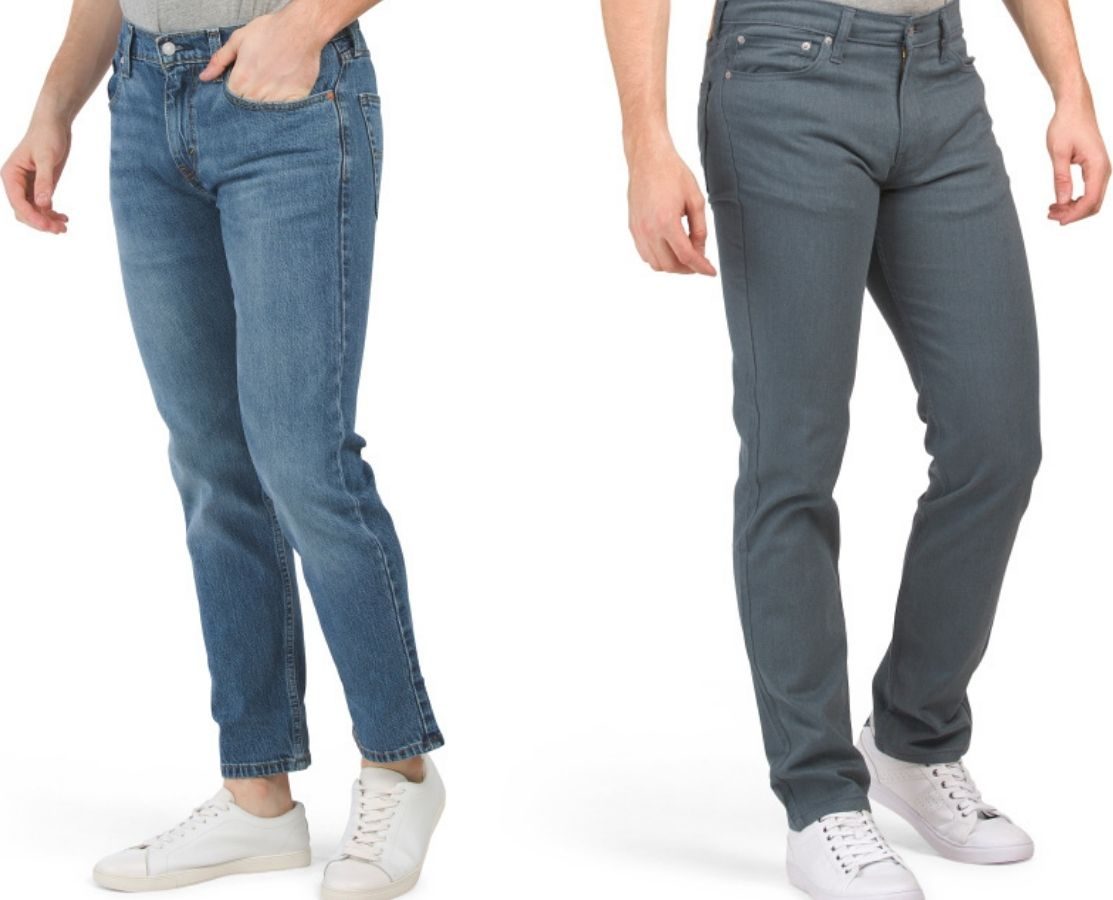 two men wearing jeans