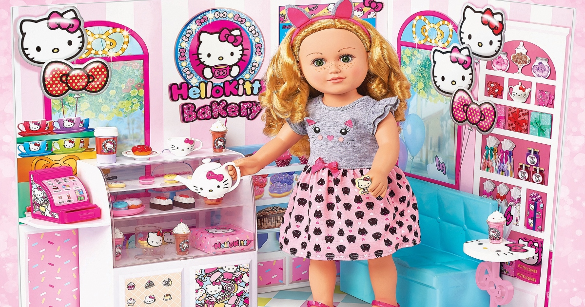 Doll in a bakery playset. it is pink and white