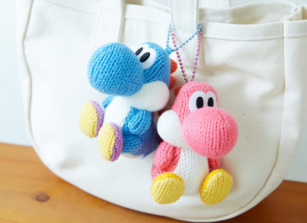 yarn yoshi's hanging from a bag