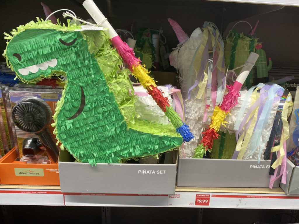 dinosaur and unicorn themed pinatas