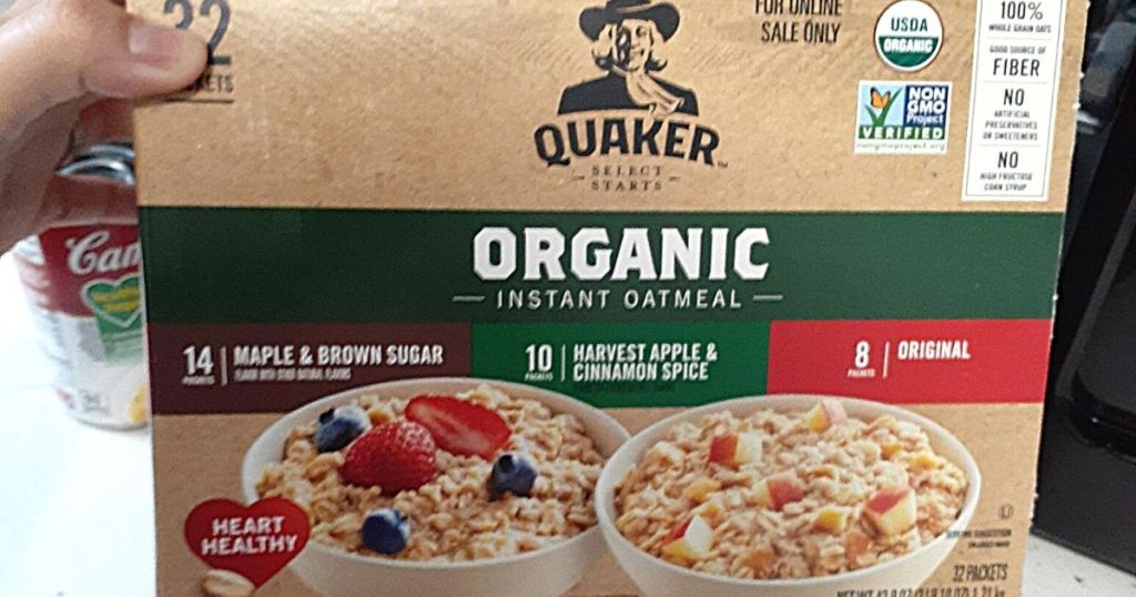 hand holding Quaker organic instant oatmeal box