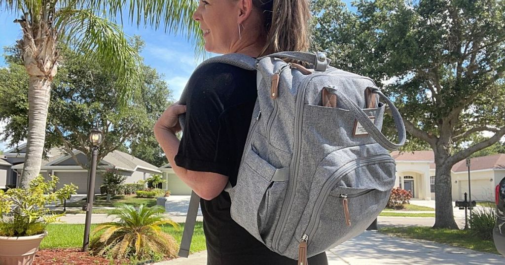 Woman carrying around Ruvalino-Diaper-Bag-Backpack in gray
