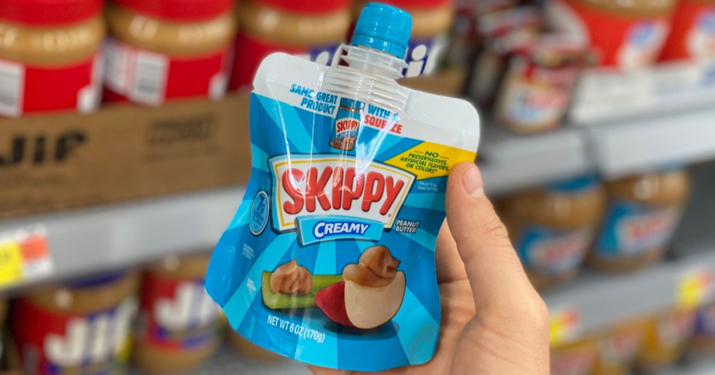hand holding pouch of Skippy