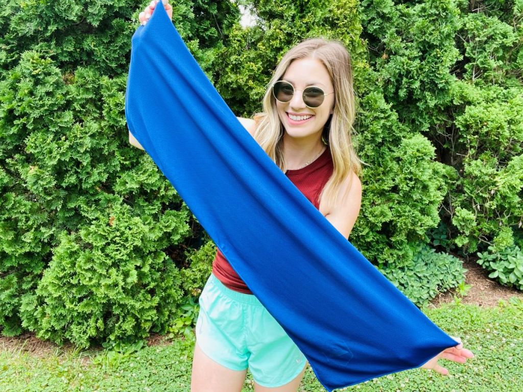 woman holding a cooling towel