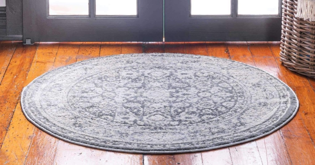 round area rug on wood floor