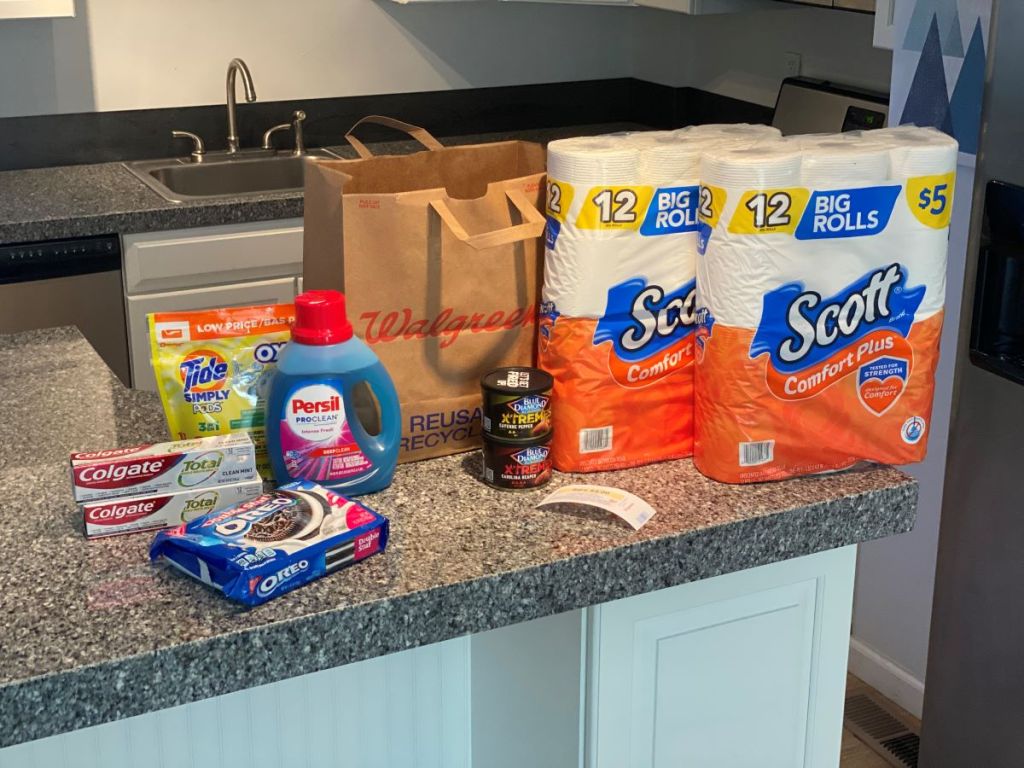 toilet paper, toothpaste, OREOs and laundry detergent on counter