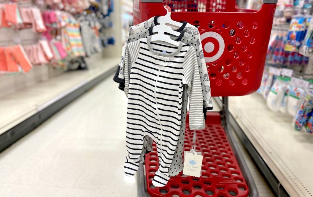 baby sleepers hanging from red target cart baby shower gift ideas