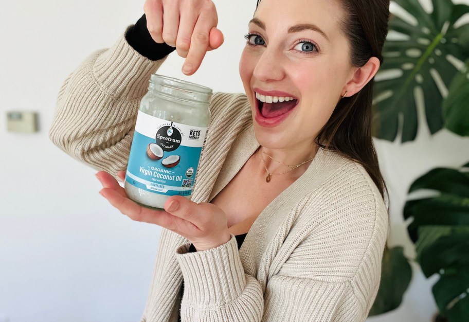 woman pointing down to coconut oil