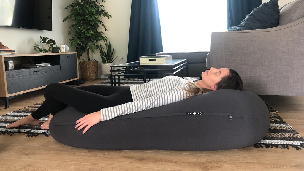 woman laying down on moon pod