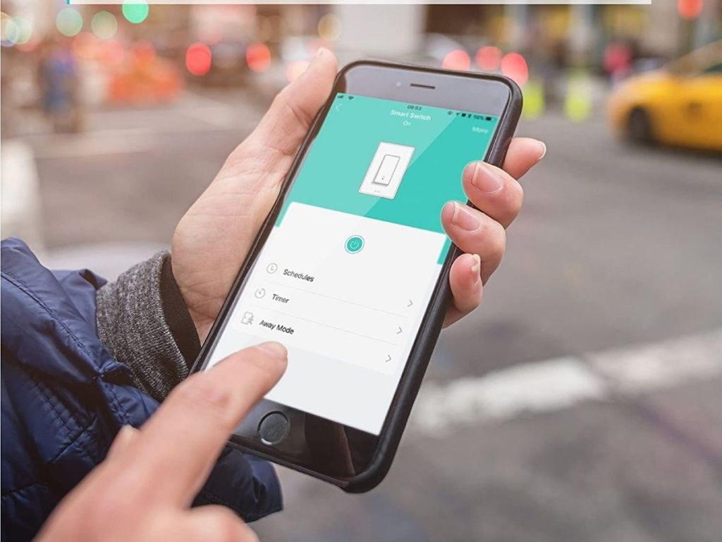 hand holding finger pointing at app on phone