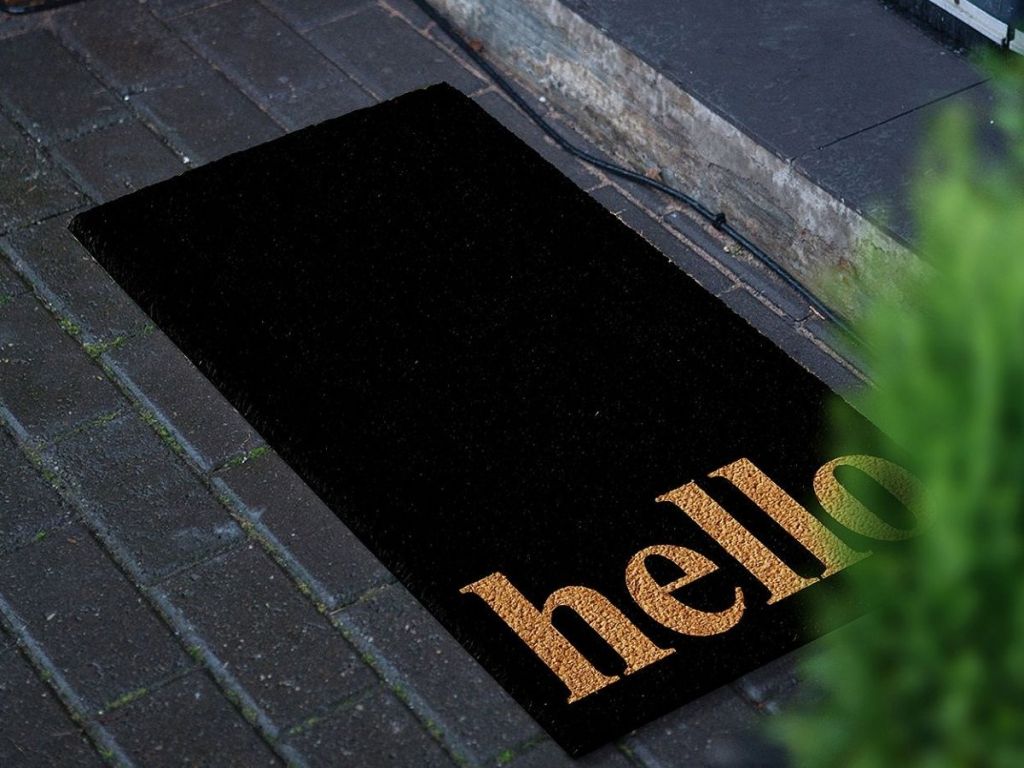 black and gold hello doormat