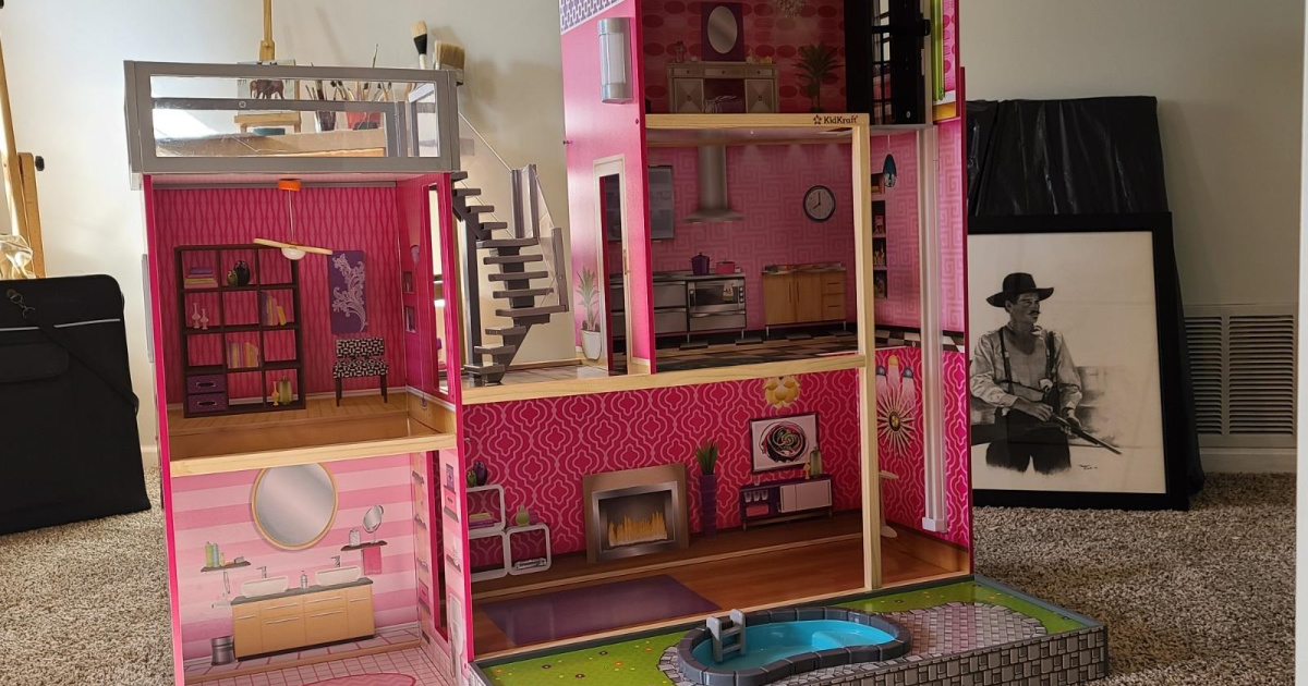 large pink dollhouse in livingroom