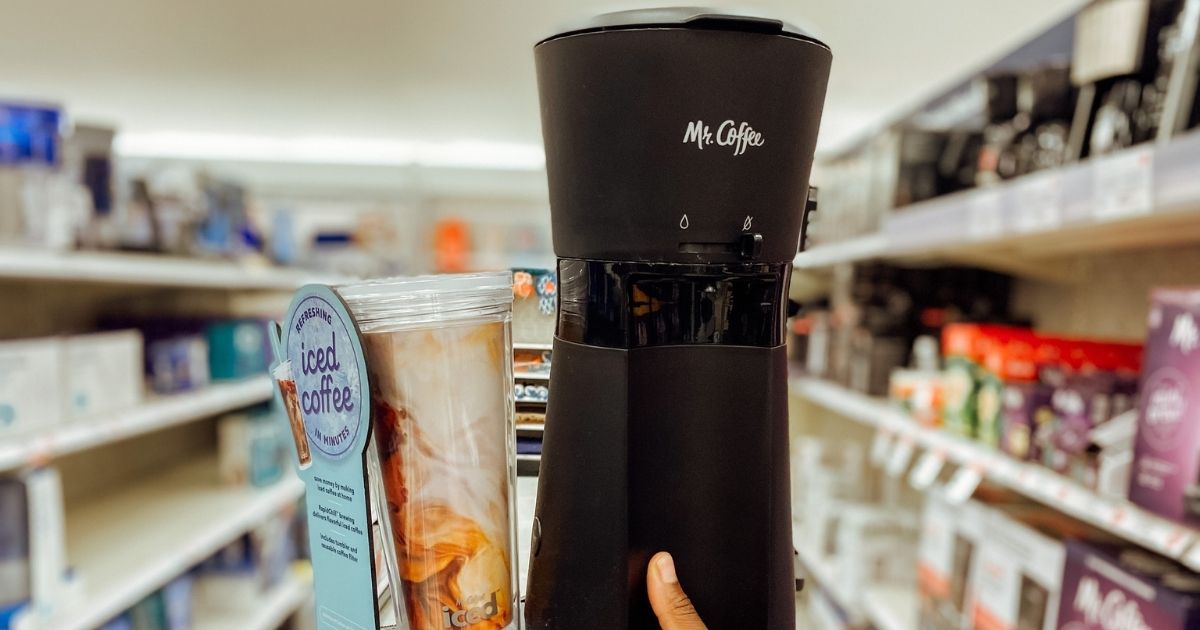 hand holding Mr. Coffee machine in store