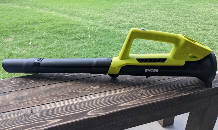 leaf blower sitting on bench outside