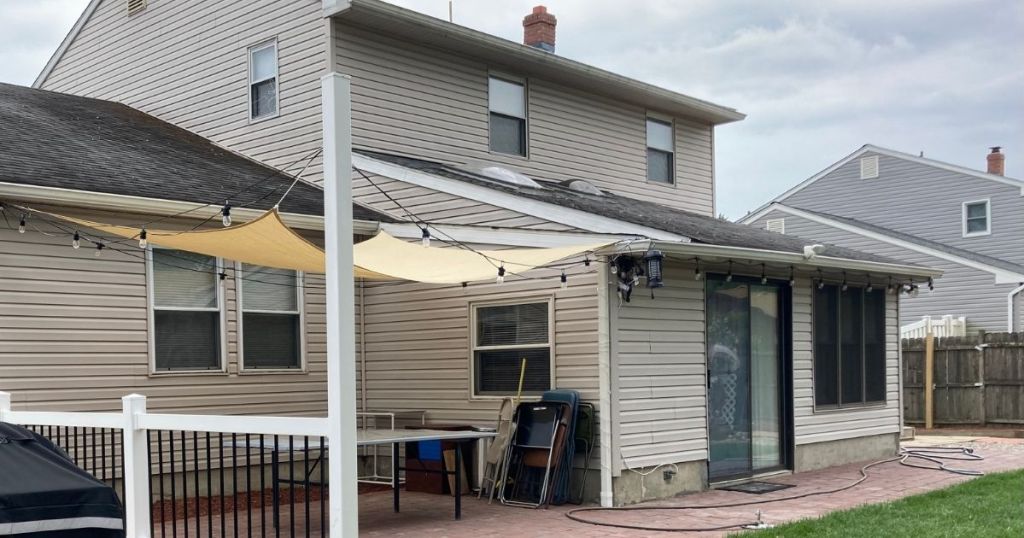 tan sun shade over patio