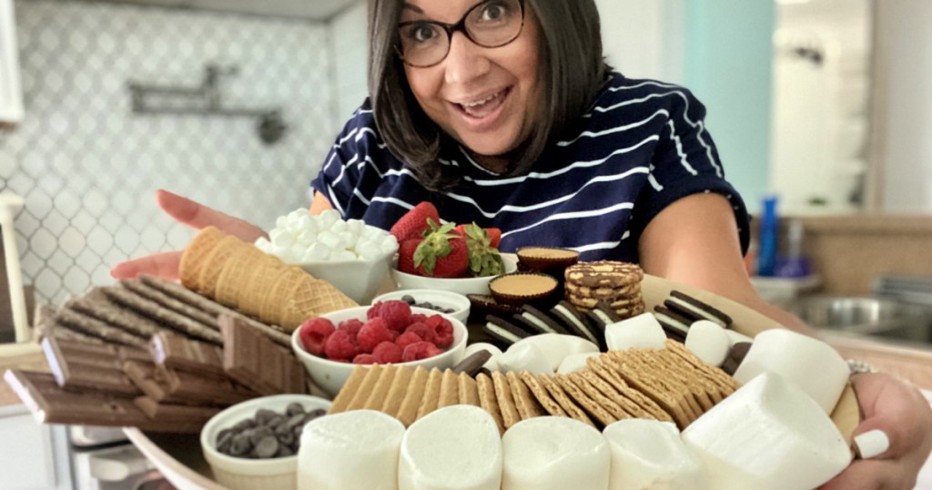 woman holding s'mores charcuterie board