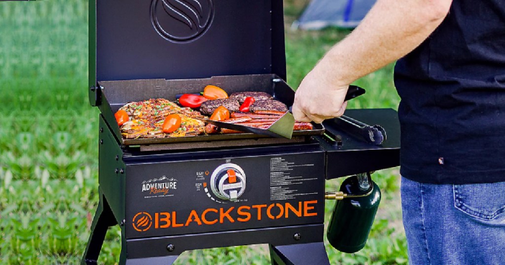 person grilling on a blackstone griddle