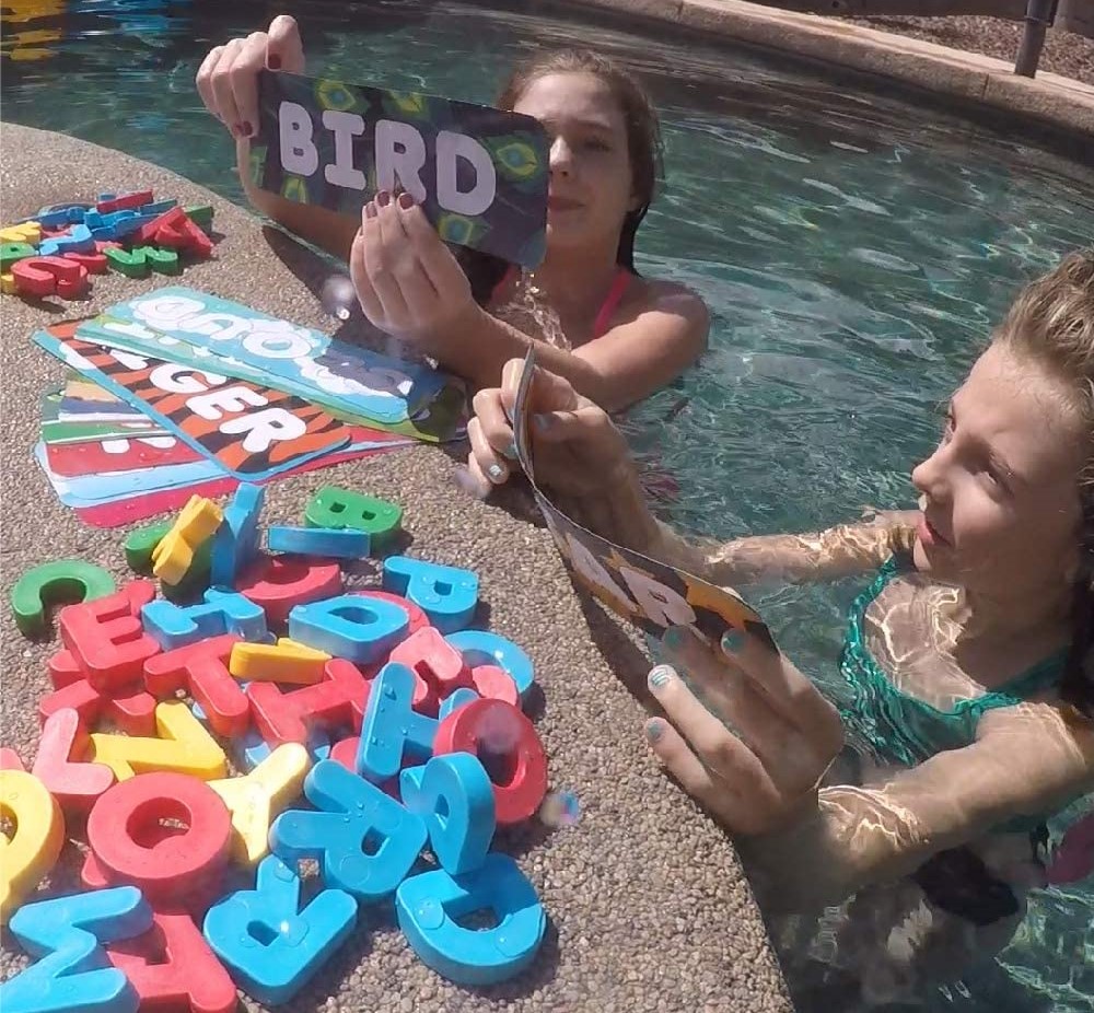 two girls playing in a pool