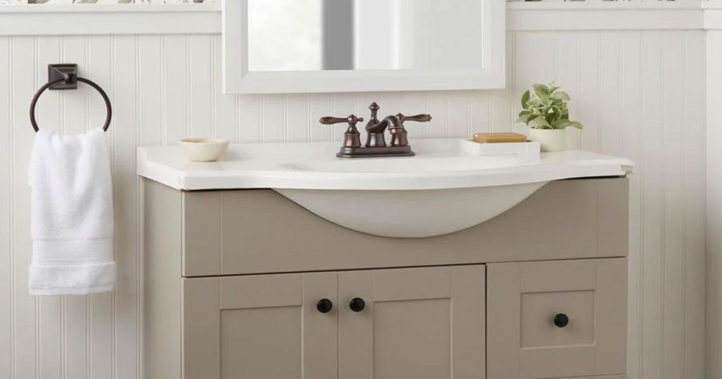 bathroom vanity with bronze faucet