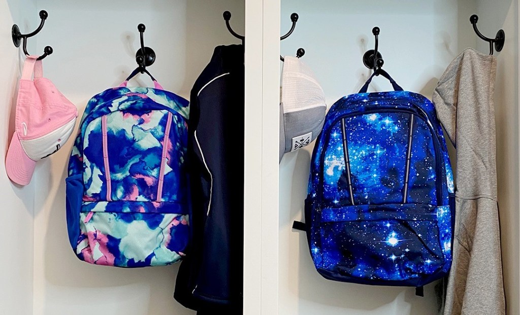 two backpacks on hooks