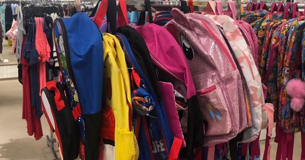 backpacks on a rack at Macy's