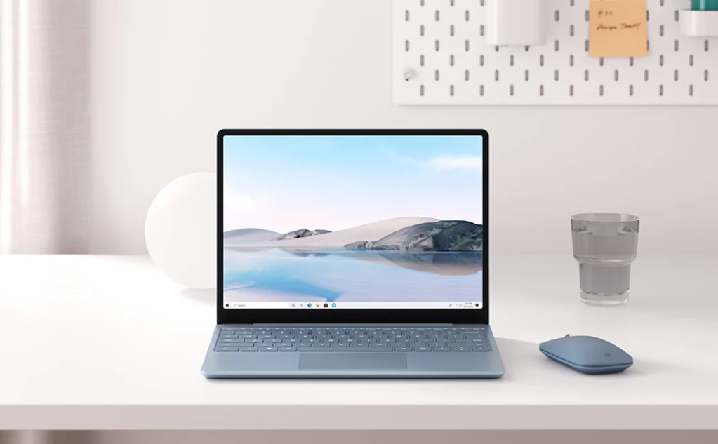 laptop on a desk with a mouse
