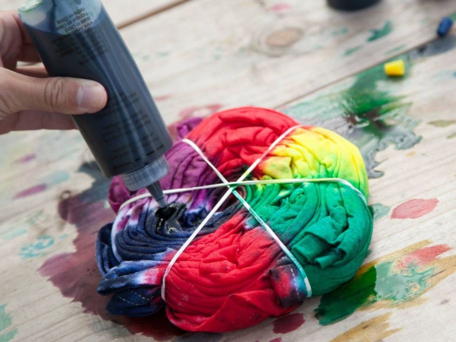 Person tie-dying a shirt