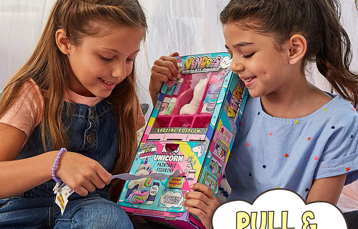 kids holding up a diy unicorn set