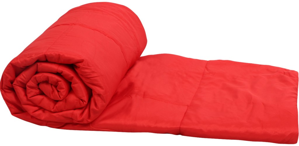 red puffy blanket rolled up