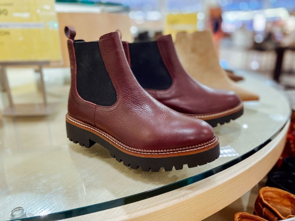 burgundy boots on display in store