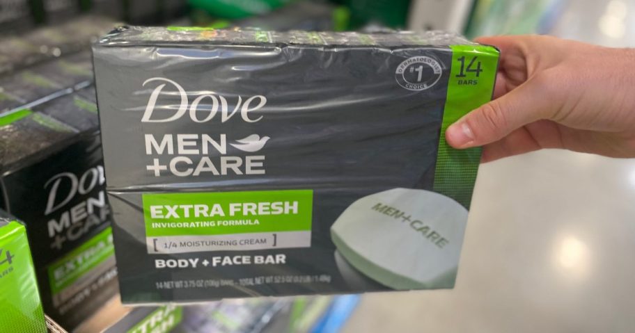 hand holding a pack of dove mens soap