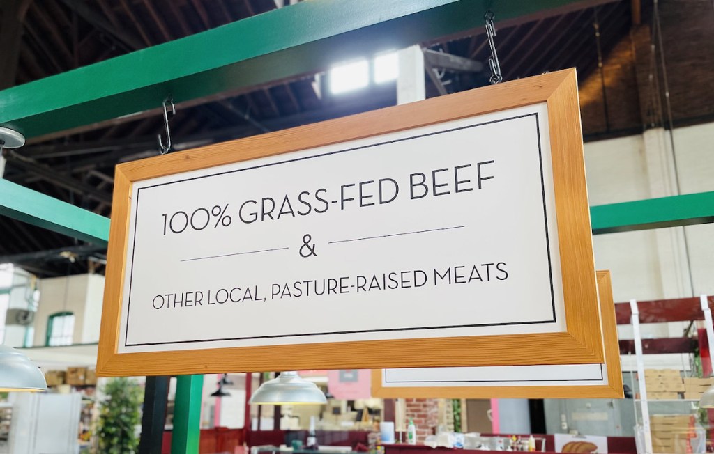 grass fed beef sign in farmers market