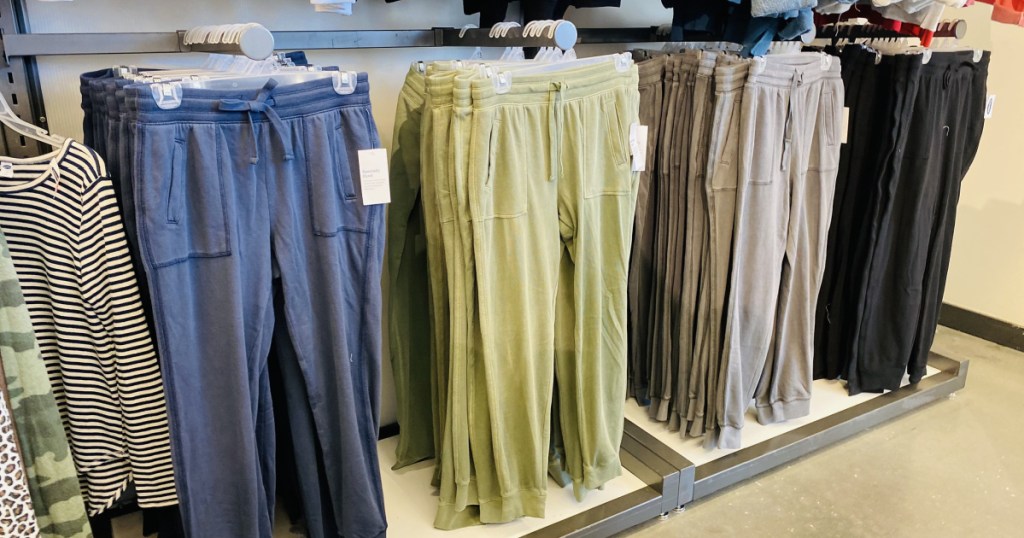 old navy joggers in store hanging up