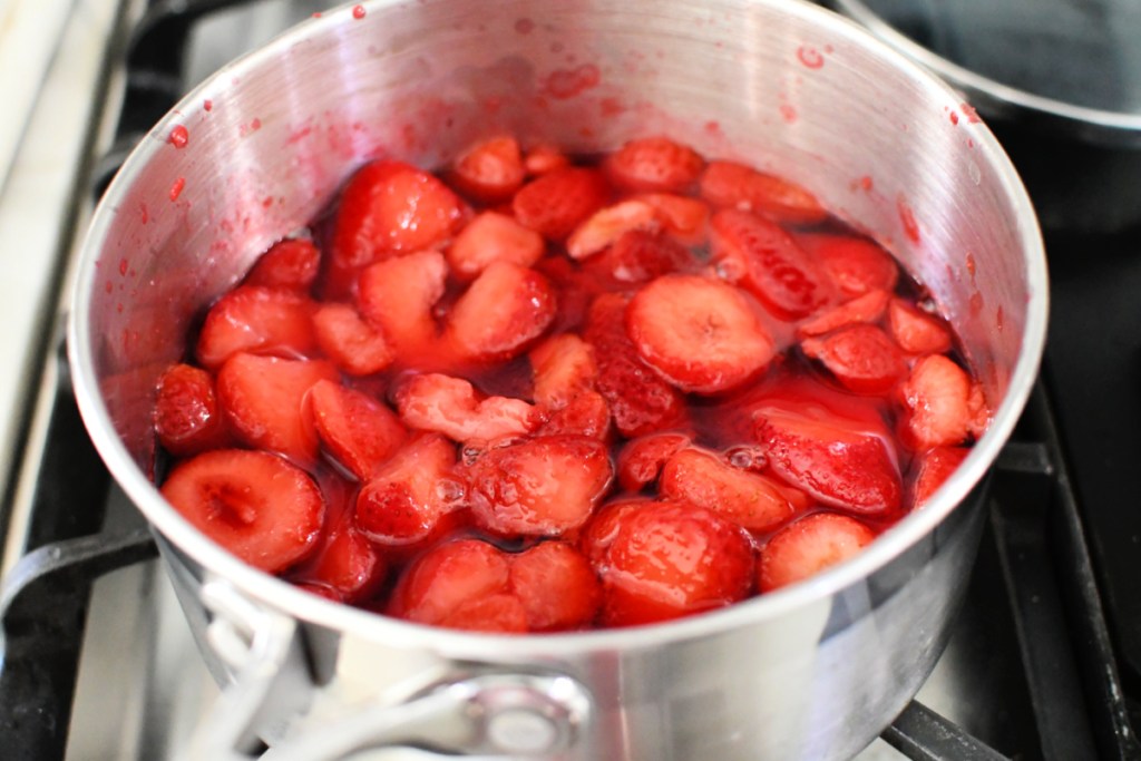 strawberries and jello in a saucepan