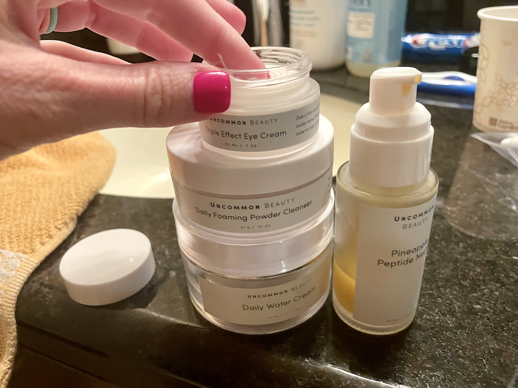 woman using uncommon beauty products in bathroom