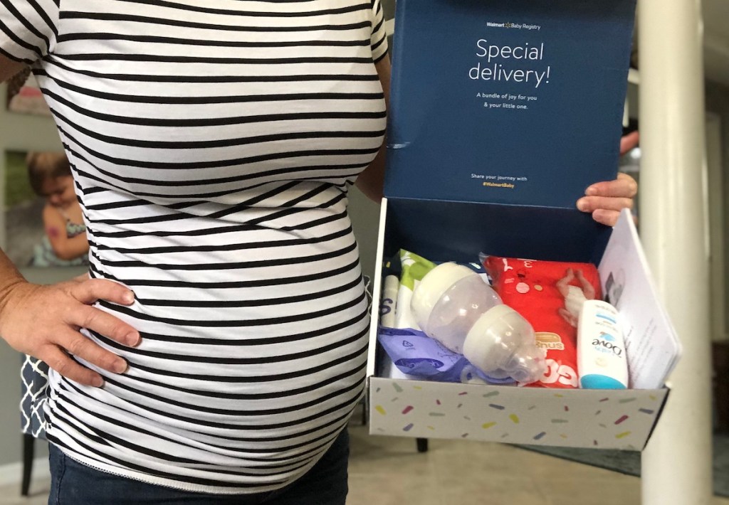 pregnany woman holding walmart baby registry box