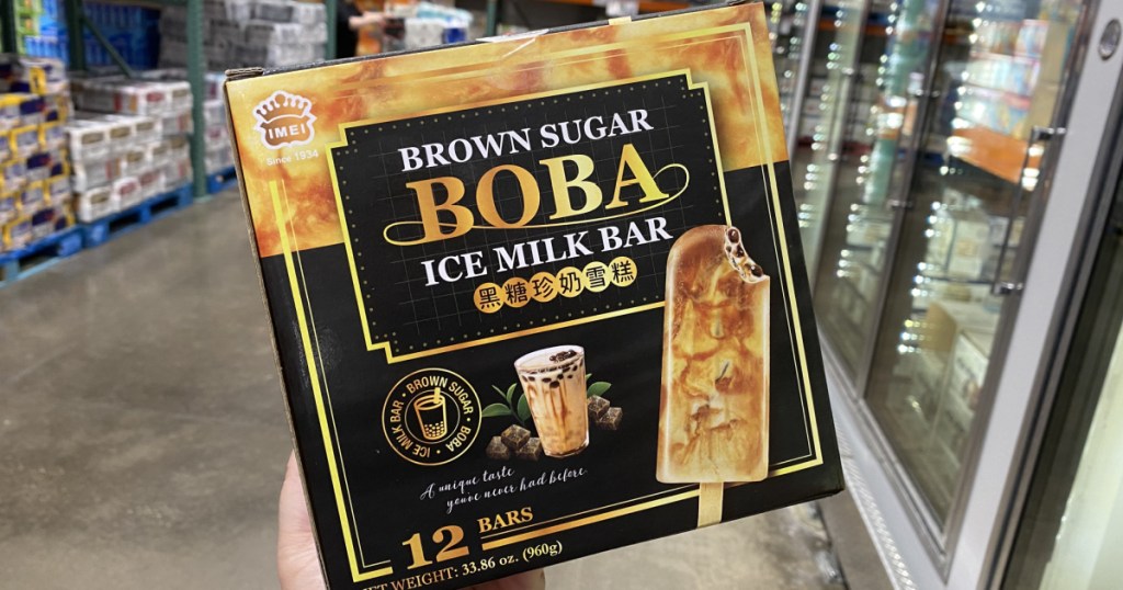 hand holding Brown Sugar Boba Ice Milk Bars 12-Count near refrigerated section