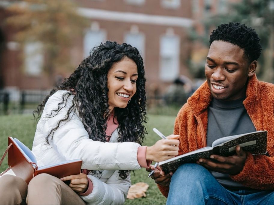 College Students studying in hopes to get a good student discount car insurance rate