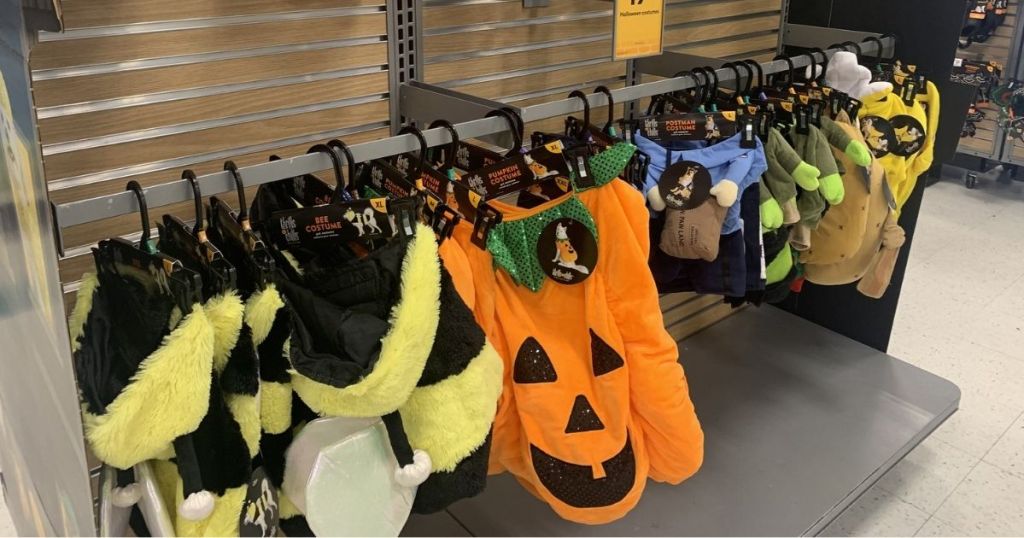 Halloween pet costumes hanging in store