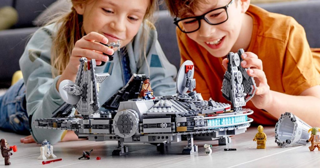 kids playing with LEGO millenium falcon