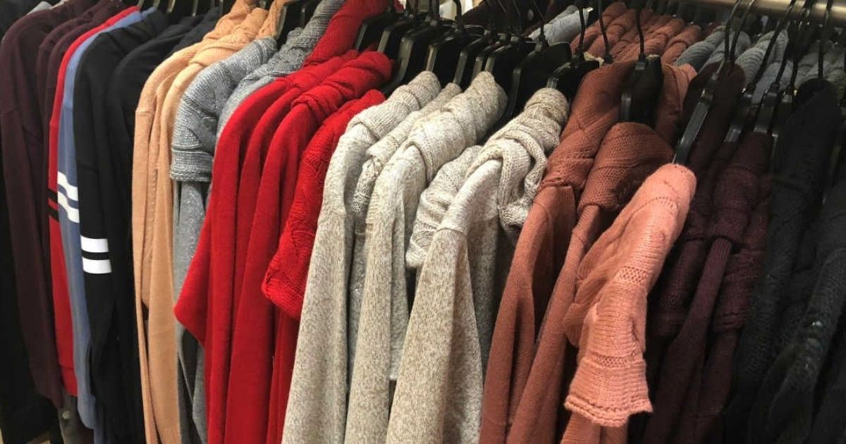 womens sweaters hanging in store