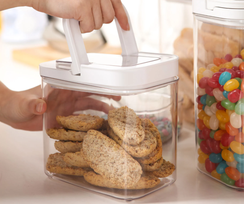 hand closing the lock on a food storage container
