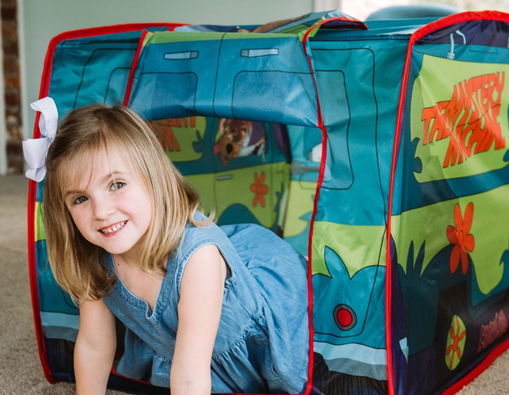girl in a Mystery Machine tent