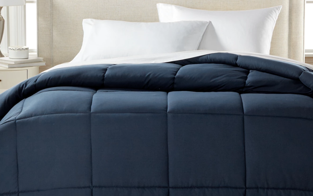 blue comforter on a bed