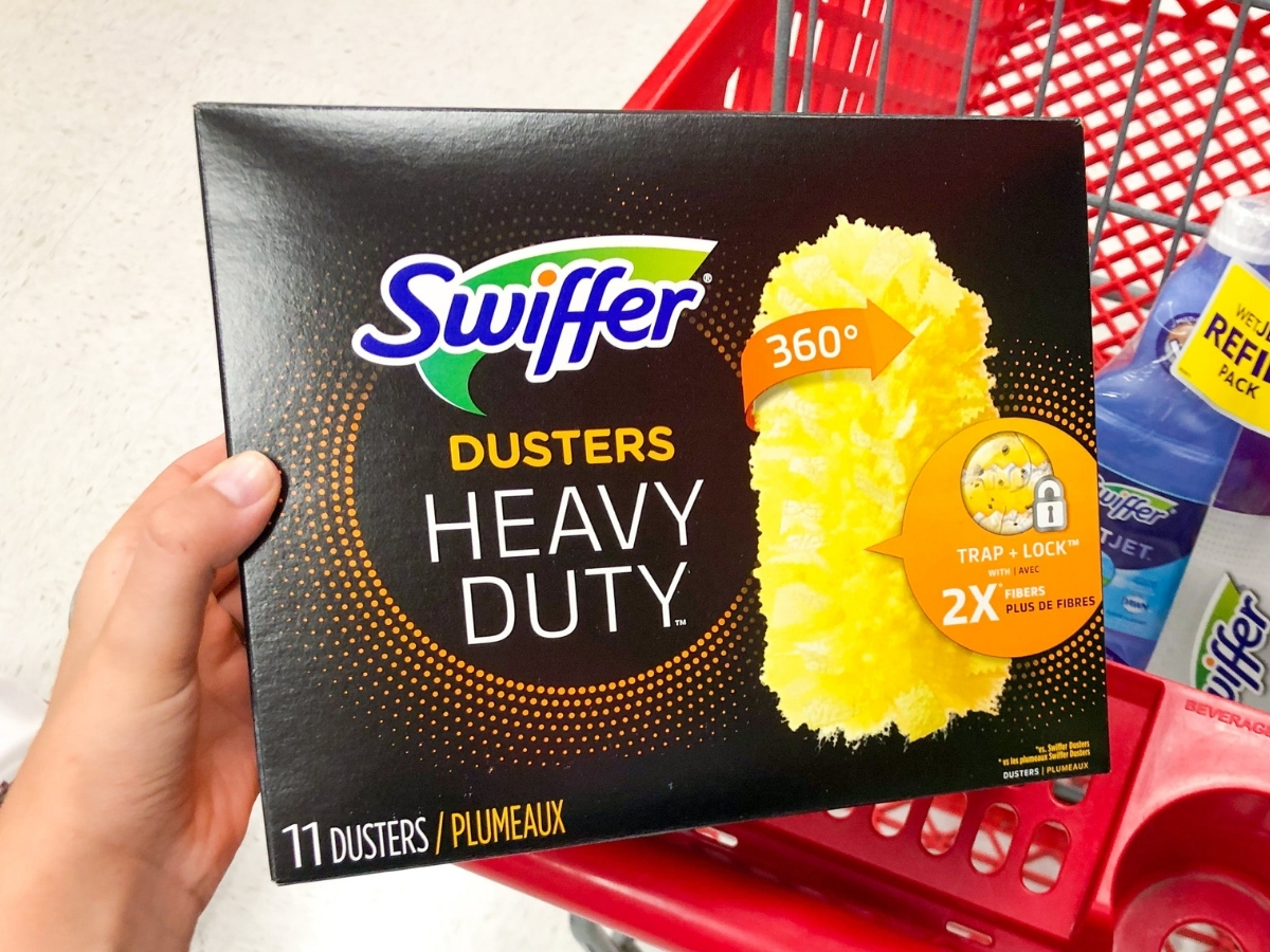 hand holding box of swiffer heavy duty duster refills